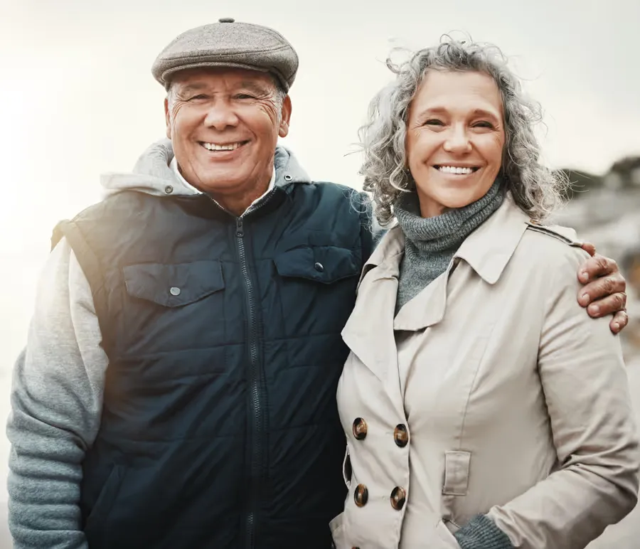 Smiling couple outdoors, relaxed and enjoying time together.